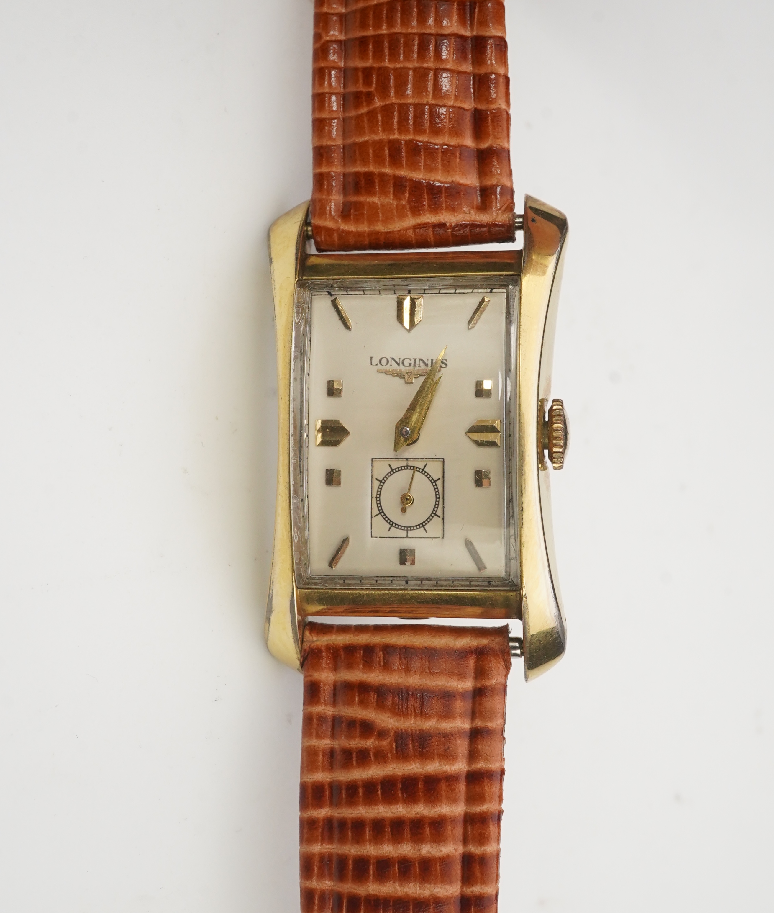 A gentleman's 1950's 10k gold filled Longines manual wind wrist watch, on a later associated leather strap